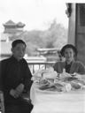 Image of Miriam Macmillan at lunch table on balcony, with Asian guide
