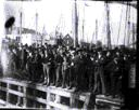 Image of Fishermen crowded on dock