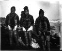 Image of 3 Inuit women, one with baby in hood