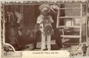 Image of Postcard: Commander Peary showing his Son [Robert, Jr.] a large camera