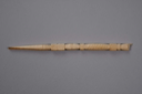 Image of ivory crochet hook with carved hand, pointing