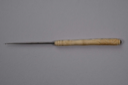Image of ivory crochet hook with flat top carved into a fish's head