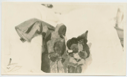 Image of Two Inuit women pouring Hay's Lime and Lemon on Bowdoin
