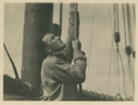 Image of Crew man hoisting sails