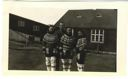 Image of Three Greenlandic women in traditional dress, with serviceman