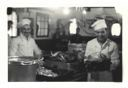 Image of Two cooks with roasted turkeys