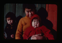 Image of Greenlandic mother with two young children in modern dress