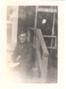 Image of Bob, sitting on steps at Camp Miles Standish