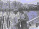 Image of Three crewmen on deck