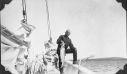 Image of Frank Henderson aboard, holding large fish