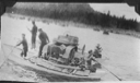 Image of Ferrying snowmobile ashore