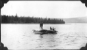 Image of Ferrying lumber ashore
