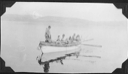 Image of Group of Eskimos [Inuit] in open boat
