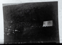 Image of Tent against rocky bluff  
