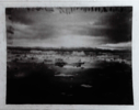 Image of Ice floes, distant mountains, clouds  