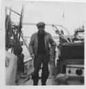 Image of Reginald Wilcox aboard with cod