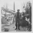 Image of Reginald Wilcox aboard with cod