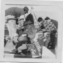Image of Marcus Sigurjenssen, Emerson Hibbard and Reginald Wilcox hose down a trawl. Mary