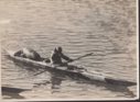 Image of Inuit in kayak, with seal float