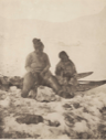 Image of Nelle-ka-tee-ah at Igloodahouny [. and second woman with baby, sitting on sledge]