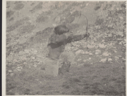 Image of Ka-ko-chee-ah with bow and arrow in shooting position