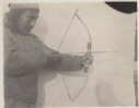 Image of Panikpah drawing bow and arrow in shooting position