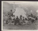 Image of Eskimos [Inuit] at Etah [Large group of Inuit by striped tupik]