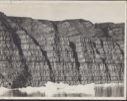 Image of Striated cliff formation, ice in foregropund