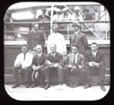 Image of Eight Expedition members, portrait by vessel