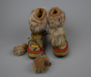 Image of Pair Alaskan fur boots, child-sized, with red trim and yellow beads