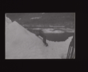 Image of Crewman climbs snowy peak  [b&w]
