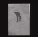 Image of Crewman with rope on snowy peak  [b&w]