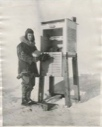 Image of Henry J. Harrison, aerologist, at the weather instruments shelter