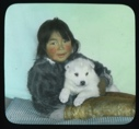 Image of Portrait: Shoo-e-ging-wah [Suakannguaq Qaerngaaq] and white puppy