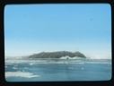Image of Iceberg and ice floes by an island