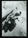 Image of Two men climbing snowy peak