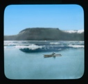 Image of Two kayakers. Ice floes beyond