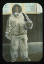 Image of Elmer Ekblaw in furs standing by Borup Lodge