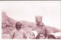 Image of Crew man with Inuit man and three children