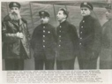 Image of Four Russian scientists, rescued from an ice floe off the east coast of Greenland, with one of their rescurers