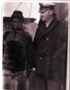 Image of Unidentified American man and an Inuit man aboard the S.S. PEARY