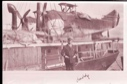 Image of Man standing by S.S. PEARY. Planes aboard, "daddy" written on border