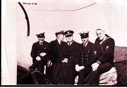 Image of Four officers and a sailor, aboard