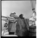 Image of MacMillan and Pilot leaning on main boom