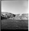 Image of "A Rockwell Kent picture" [Greenland coast, small village] 