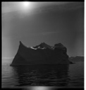 Image of Iceberg, sun and reflectioms
