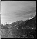 Image of Snow-covered coastal mountains, ice floes