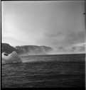 Image of Small iceberg, mist and mountains