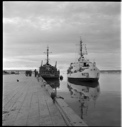 Image of EASTWIND and ATKA moored at pier. Reflections