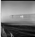 Image of BOWDOIN's deep wake, distant iceberg